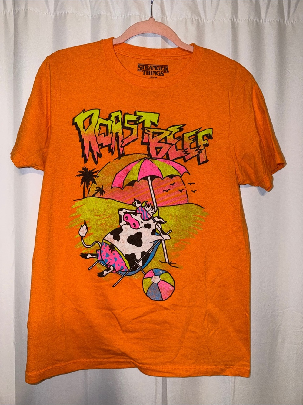 Netflix Stranger Things Orange Graphic Tee with Neon Cow Print